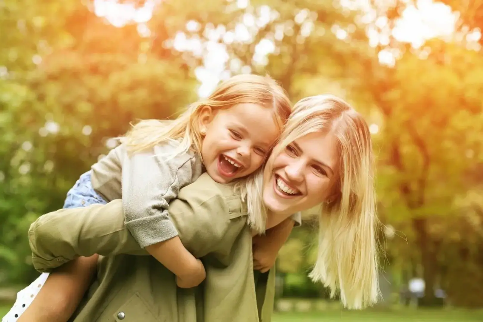 Why-Families-Choose-Choice-Care-Homepage woman smiling and laughing with child on her back